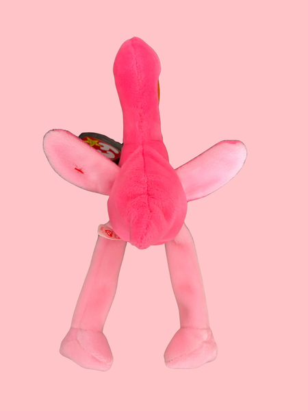 Pink plush toy on a pink background